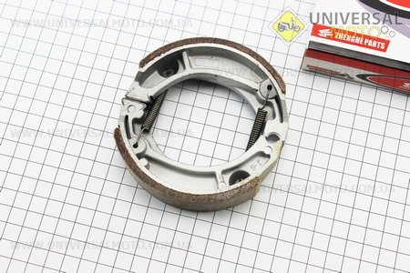 Гальмівні колодки задні комплект, 105мм (пружини під кутом). ZHENGHE (Запчастини для мопеда Дельта / UM3387-V74)